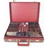 A Solingen of Germany canteen of cutlery, 18/10, in a red leather suitcase with two layers.