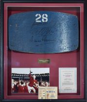 An original 1966 seat back from Wembley National Stadium, seat number 28, signed by Gordon Banks,