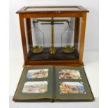 A set of Griffin and Tatlock Ltd scales in a glass case, case measures 45 by 23 by 41cm high,