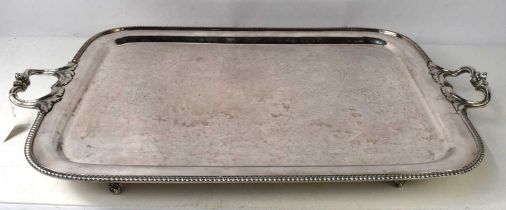 A silver plated tray of good proportions with foliate handles and beaded rim.