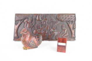 A group of collectables comprising a carved and painted wooden hen, two packs of vintage playing