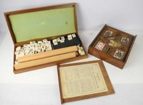 A vintage boxed set of Nain Jaune (The game of The yellow Dwarf) with bone counters and Mahjong
