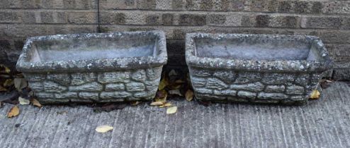 Two reconstituted stone planters of rectangular form.