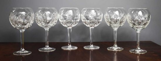 A set of six Waterford Millenium Collection cut crystal wine glasses.