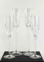 A pair of fine Stuart Crystal champagne flutes, with long tapering stems and fern decoration, 31cm