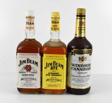 A bottle of Jim Beam Straight Rye Whiskey, a bottle of Jim Beam Sour Mash, Kentucky Straight Bourbon