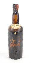 A bottle of Crofts 1945 Vintage Port, bottled in 1947, cap and label present, signs of seepage,