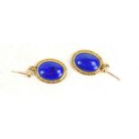 A pair of 9ct gold and lapis drop earrings, each oval lapis cabochon within a rope twist gold