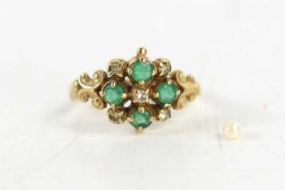 A 9ct gold, diamond and emerald ring, of vintage style, set with four emeralds in a quatrefoil,