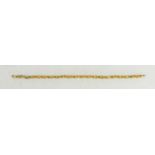 A 9ct gold and citrine bracelet, set with twenty oval cut citrines, 19cm long, 4.43g. [This lot