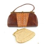 A vintage crocodile skin handbag, with tail back panel and a vintage beaded evening bag. [This lot