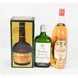A litre bottle of Grants Finest Scotch Whisky, together with a litre bottle of Courvoisier VSOP
