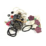 A group of silver and costume jewellery including a silver bangle, a silver bracelet set with