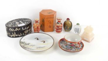 A collection of Chinese and Japanese wares, including a rose quartz seal in the form of a lion, a