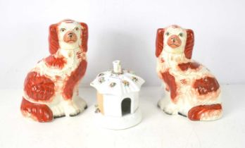 A pair of 19th century Staffordshire Spaniel flatbacks together with a Staffordshire pastille