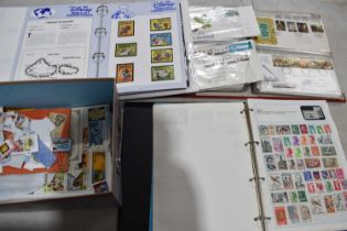 A collection of stamps including First Day Covers and The Disney World of Postage Stamps. [This