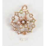 A Victorian 9ct gold and opal flowerhead brooch and pendant, the central opal surrounded by six