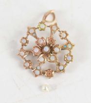 A Victorian 9ct gold and opal flowerhead brooch and pendant, the central opal surrounded by six