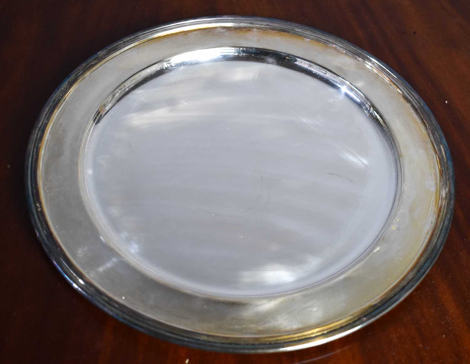 An Italian silver platter, 800 grade, with cheeseboard wooden roundel (removable) seated within