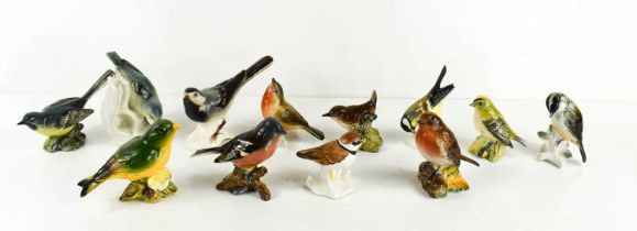 A group of Beswick and Goebel birds, including Goebel Wagtail, Ringed Plover, Great Titmouse, two