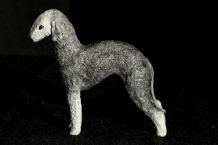 A finely detailed porcelain Bedlington Terrier, synonymous with artist Cragie Aitichson, 12cm tall x