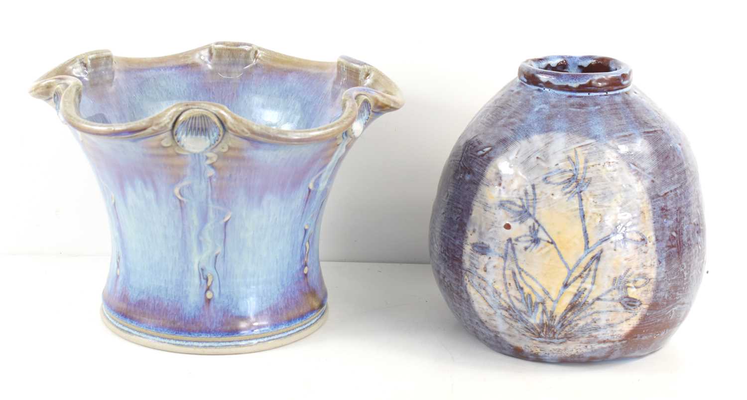 A studio pottery vase with fluted rim, in purple and blue colours, stamped W possibly for Wayne