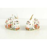 A pair of Royal Crown Derby Meadow Rabbit paperweights, one with a silver stopper the other with a