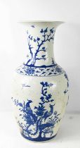 A Chinese early 20th century blue and white vase with 'orange peel' glazed finish, depicting birds