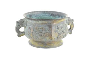 A Chinese bronze bowl or possibly censor, with lion handles and abstract motifs, 16 by 23 by 11cm