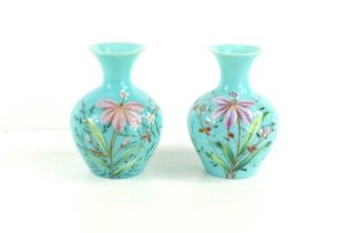 A pair of Bohemian pale green glass vases, decorated with flowers, 13cm high.