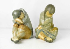 A pair of Lladro porcelain Inuit figures comprising girl, 31cm high and child, 26cm high, both