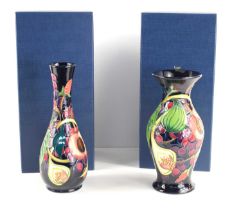 Two Moorcroft Pottery vases in the Queen's Choice pattern, comprising a baluster vase and a bottle