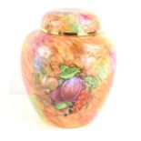 A handpainted ginger jar by Staffordshire Craftsman, the vase decorated with fruits, 16cm high.