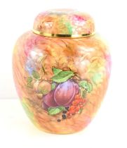A handpainted ginger jar by Staffordshire Craftsman, the vase decorated with fruits, 16cm high.