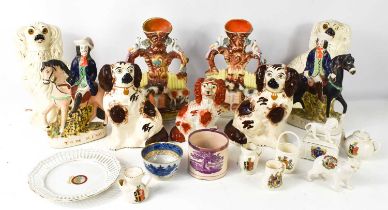 A selection of Victorian Staffordshire to include two pairs of dogs, a pair of spill vases, and pair