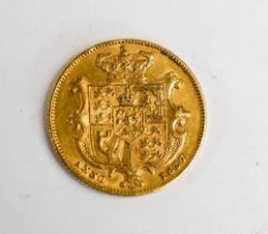 A rare gold 1837 William IV full sovereign.