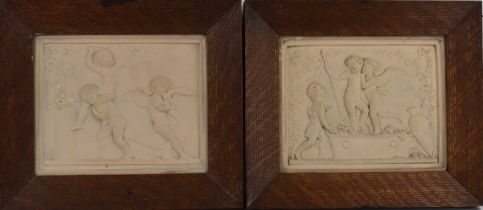 A pair of neo-classical Parian plaques, each of Bacchanalian putti, one of putti in a wine press