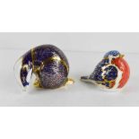 Two Royal Crown Derby paperweights, one in the form of a badger (lacking stopper) the other in the