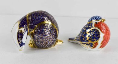 Two Royal Crown Derby paperweights, one in the form of a badger (lacking stopper) the other in the