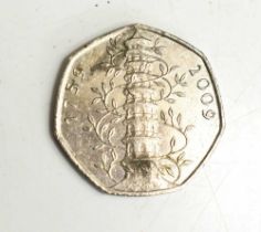 A Kew Gardens 50p circulated, together with a Churchill commemorative coin and a 1937 crown.