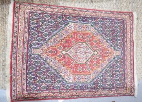 A small Middle eastern rug / prayer mat with central diamond motif, 103cm by 72cm