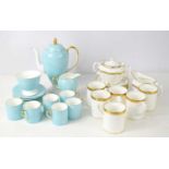 A Wedgwood turquoise coloured coffee set, the handles and rims having gilt decoration, comprising of