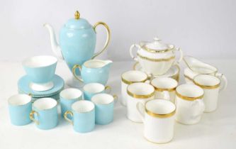 A Wedgwood turquoise coloured coffee set, the handles and rims having gilt decoration, comprising of
