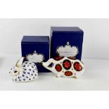 Two Royal Crown Derby paperweights, pig with silver stopper 12cm long, and rabbit, both with