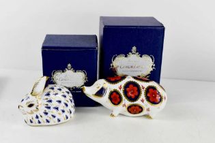 Two Royal Crown Derby paperweights, pig with silver stopper 12cm long, and rabbit, both with