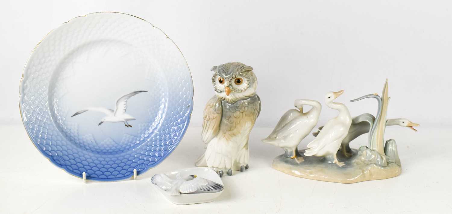 A Lladro figure group of geese, number 4549, a Nao Owl, a German porcelain trinket dish modelled