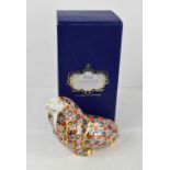A Royal Crown Derby paperweight in the form of a walrus, with gold stopper and original box, 11cm