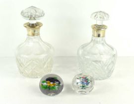 Two cut glass decanters with silver collars of similar style together with two vintage glass