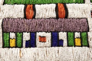 A mid 20th century South African Ndebele tribal "ijogolo" Marriage Apron in animal hide with