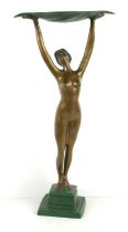 An Art Deco style bronzed sculpture of a nude lady with a leaf held aloft, 46cm high.